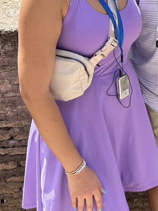 GLP-1 medical weight loss before, patient in fitted dress prior to program.