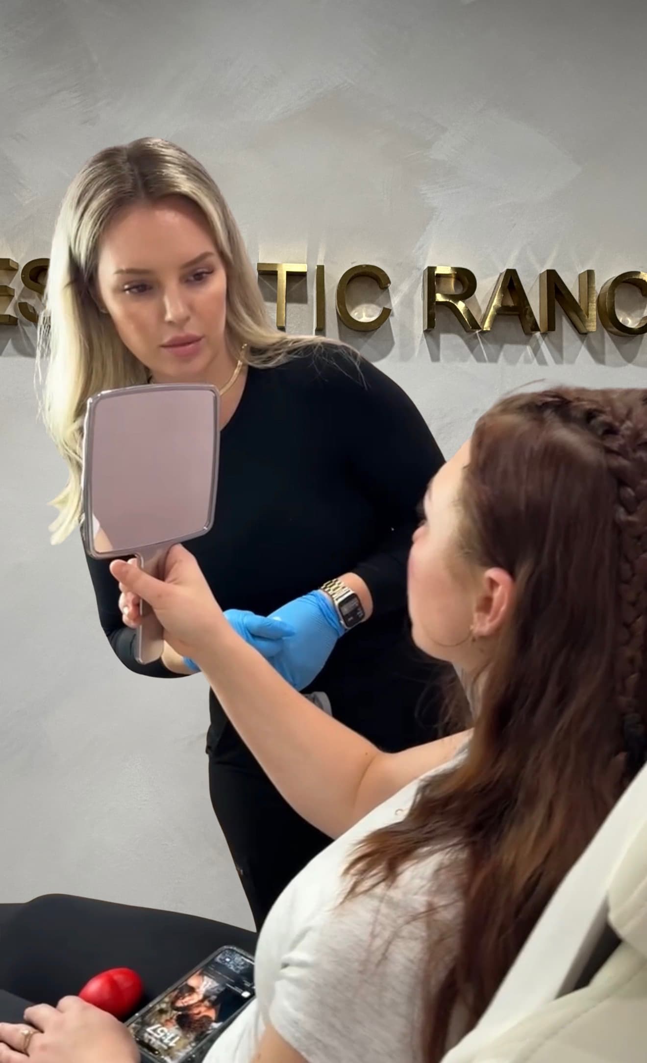 Natasha Wilkes, MSN, APRN, founder of The Aesthetic Ranch, consulting with a patient in the Fort Lauderdale studio.