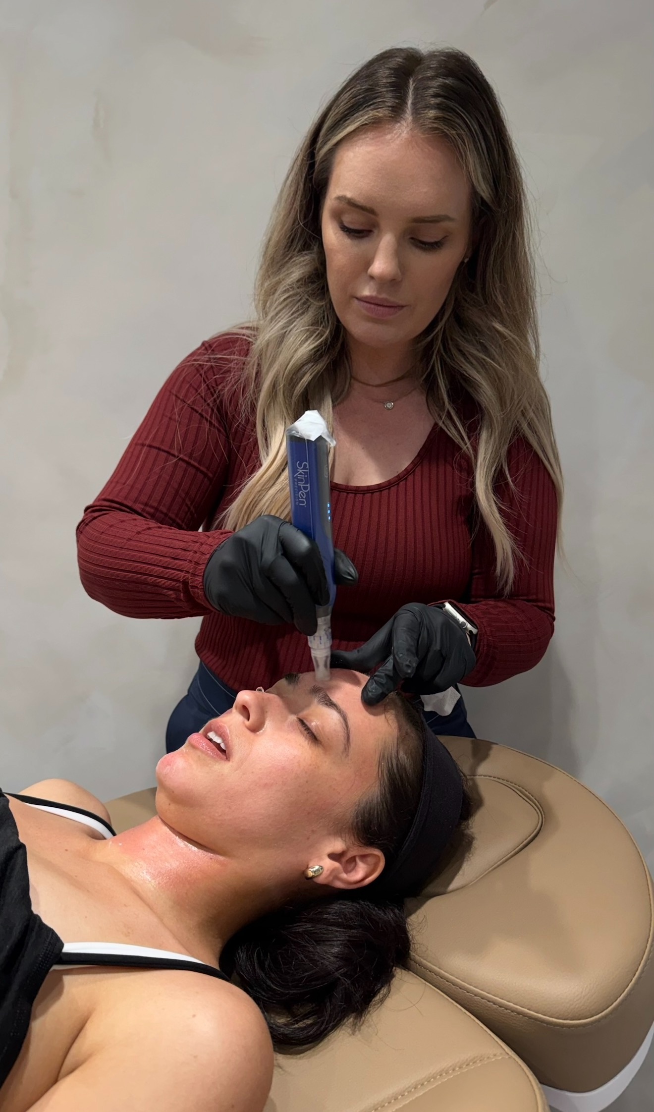 Inside the treatment room at The Aesthetic Ranch in downtown Fort Lauderdale, FL — Natasha Wilkes, MSN, APRN, FNP-BC performing a SkinPen Precision microneedling session in the studio.